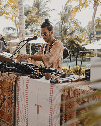 A musician performing at a TFest poolside session