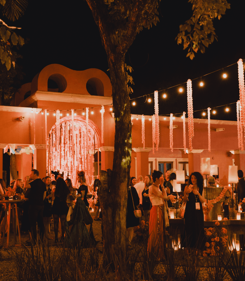 Guests at a TFest evening party under festoon lights